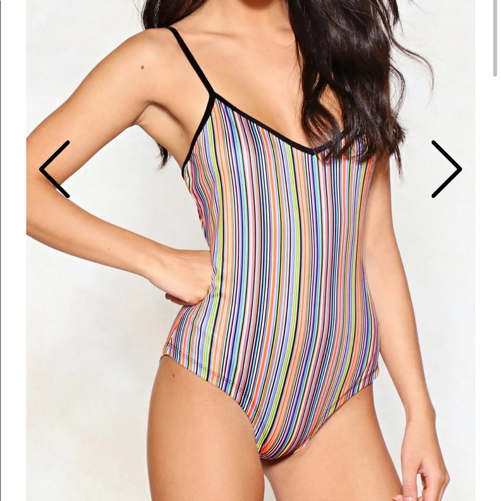 Bright, vertically-striped rainbow bodysuit.